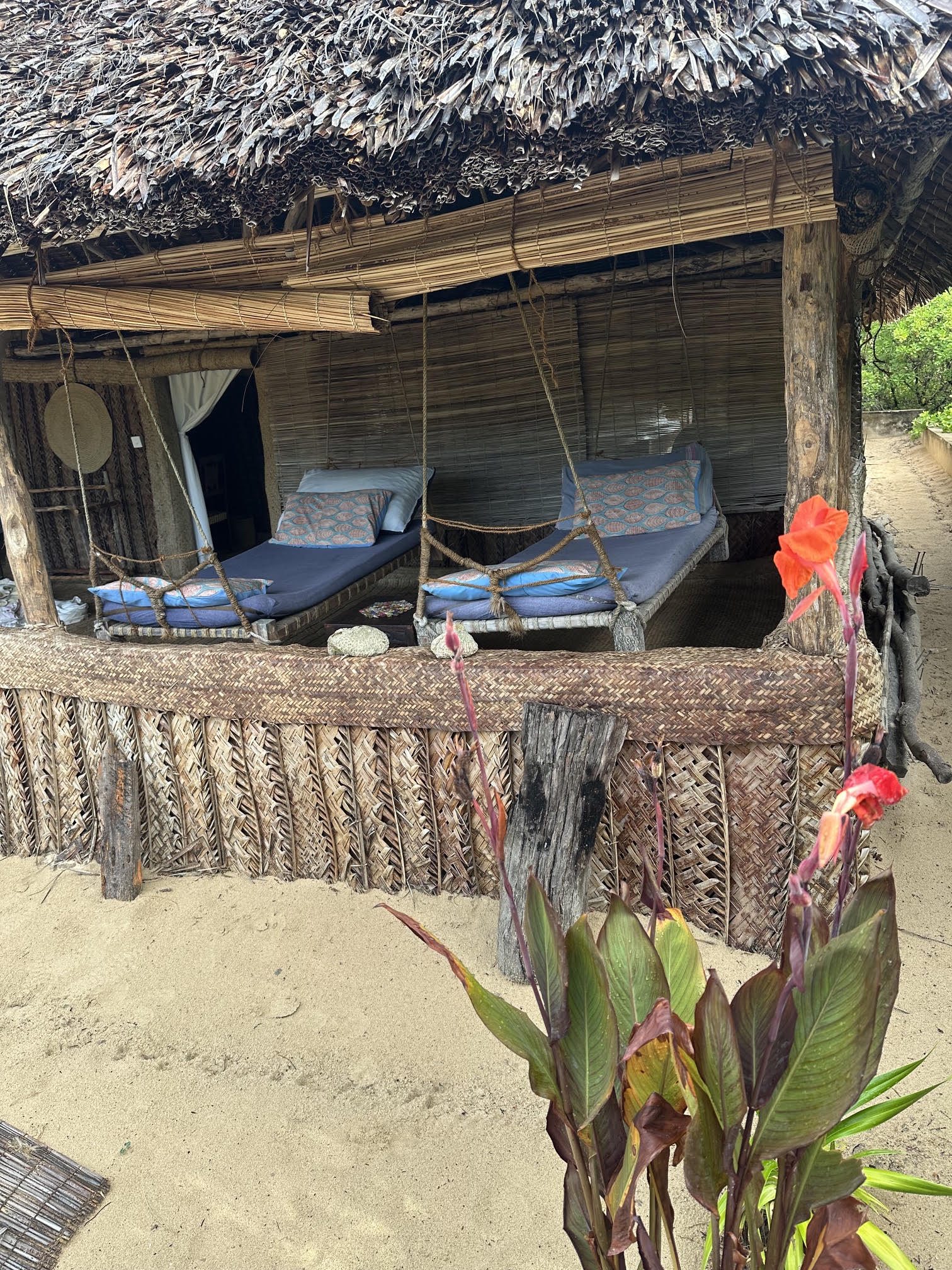 Family banda terrace swing beds and garden view